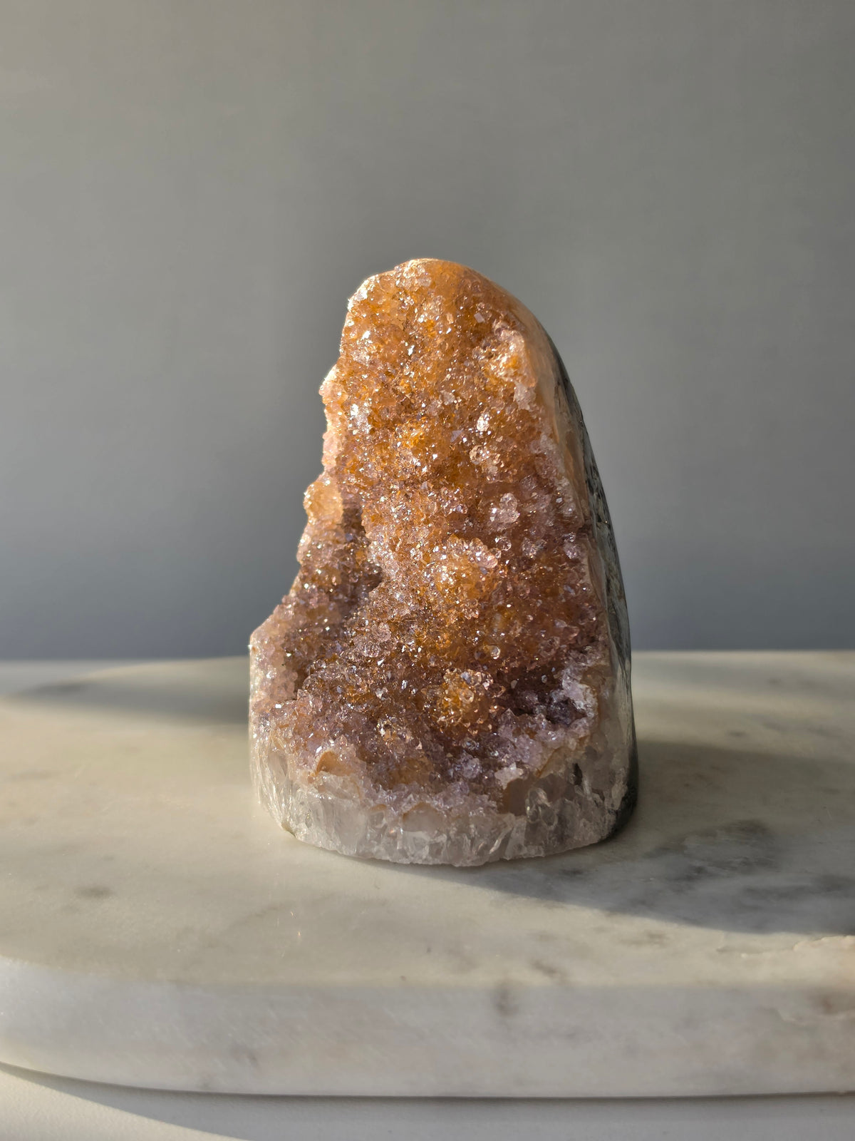 Druzy Golden Amethyst cut base from Uruguay with intensely sparkling crystal druzy surface and warm golden lilac and pink tones 482g 10cm