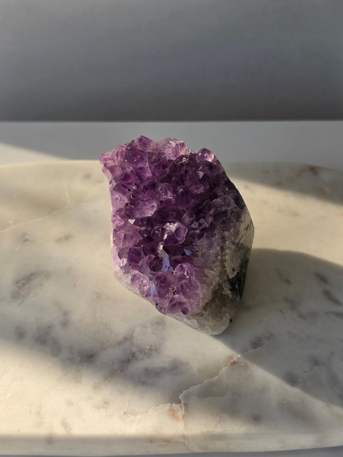 Natural Amethyst freeform cluster with deep purple and lavender crystal formations and dark natural matrix