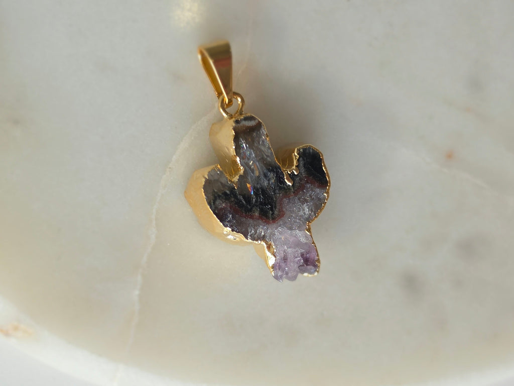 Amethyst and agate cactus slice pendant featuring deep translucent smoky-grey agate, red banding and purple crystal formations and a 24K gold-plated outline.
