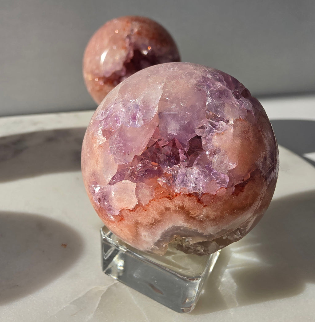 Luxury Pink Amethyst crystal sphere from Brazil with soft blush and lilac tones and a dramatic sparkling crystalline interior