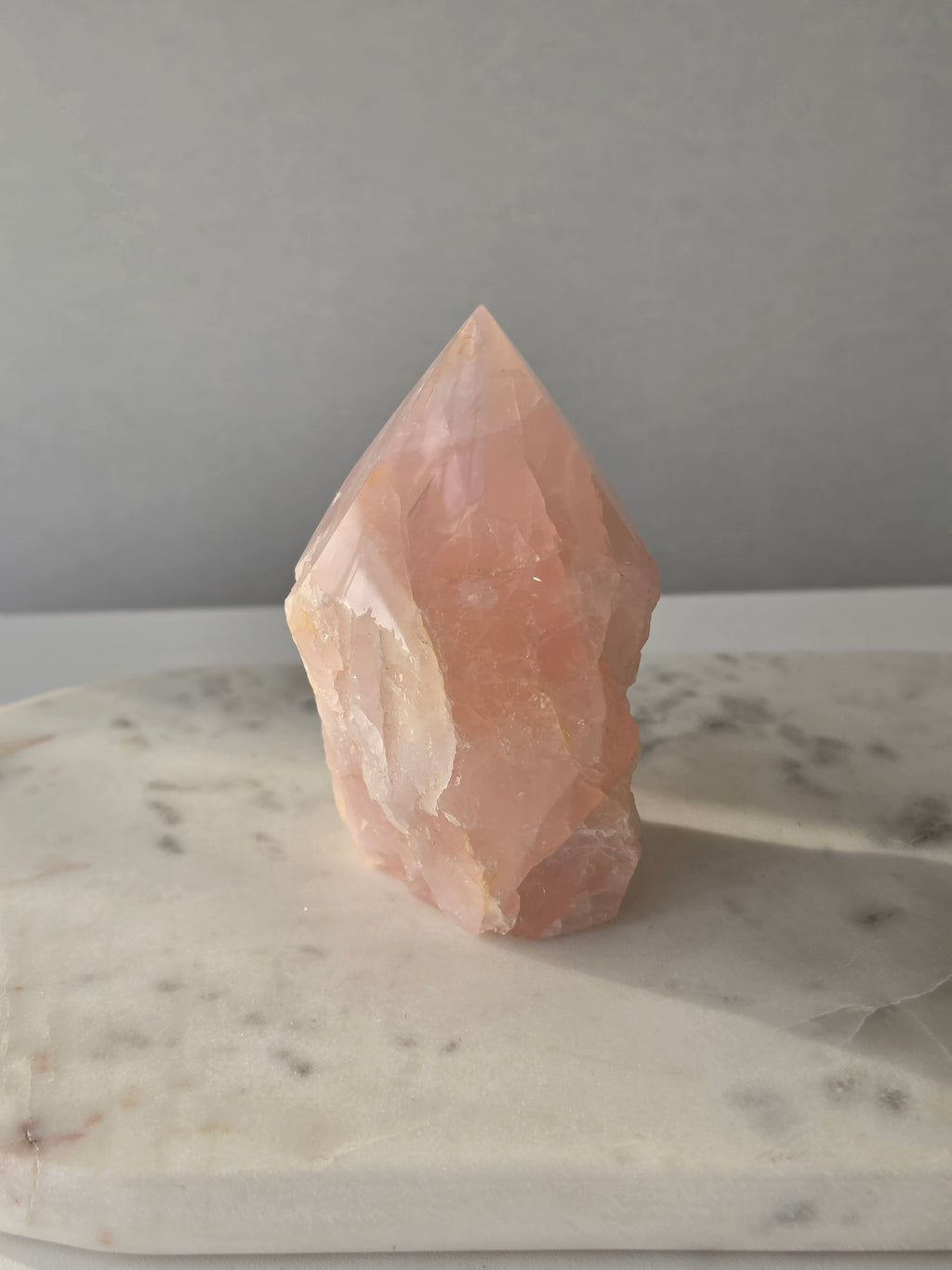 Natural Rose Quartz tower with soft blush-pink colouring and subtle warm golden healer inclusions, weighing 466g and measuring 10cm