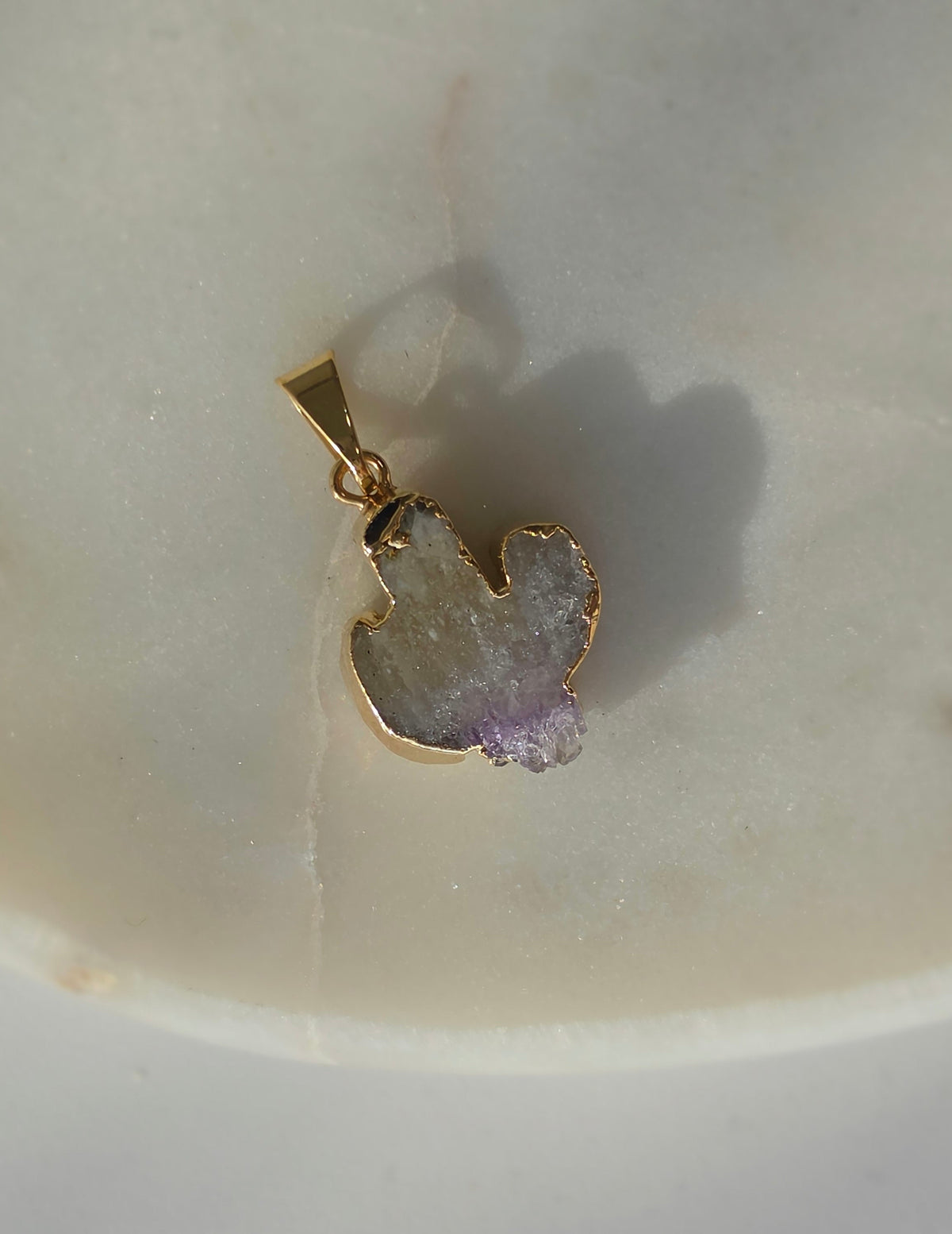 Amethyst and agate cactus slice pendant featuring purple crystal formations and a 24K gold-plated outline.
