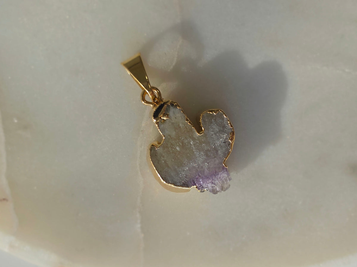 Amethyst and agate cactus slice pendant featuring purple crystal formations and a 24K gold-plated outline.