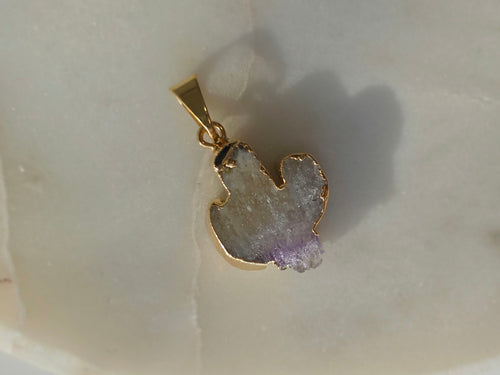 Amethyst and agate cactus slice pendant featuring purple crystal formations and a 24K gold-plated outline.