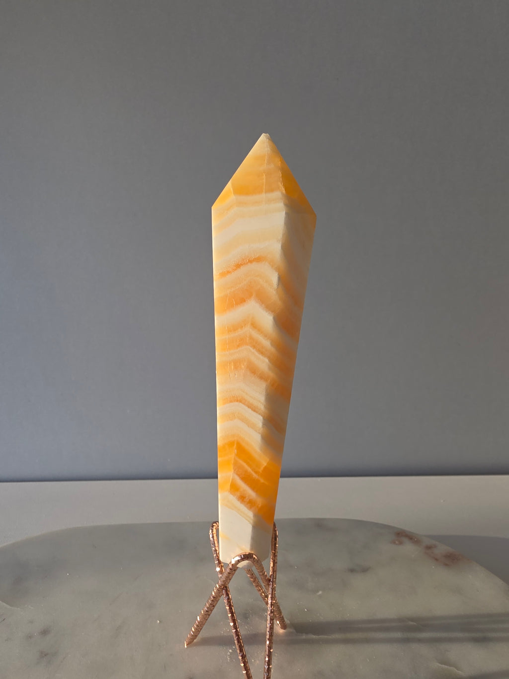 Luxury Yellow Banded Calcite Wand by Stone and Bloom featuring warm golden and cream natural banding, on trend, Crystals, Calcite, Wand