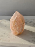 Chunky Rose Quartz and Golden Healer Quartz tower with soft blush pink colouring, warm golden inclusions and a combination of raw crystal texture and polished surfaces