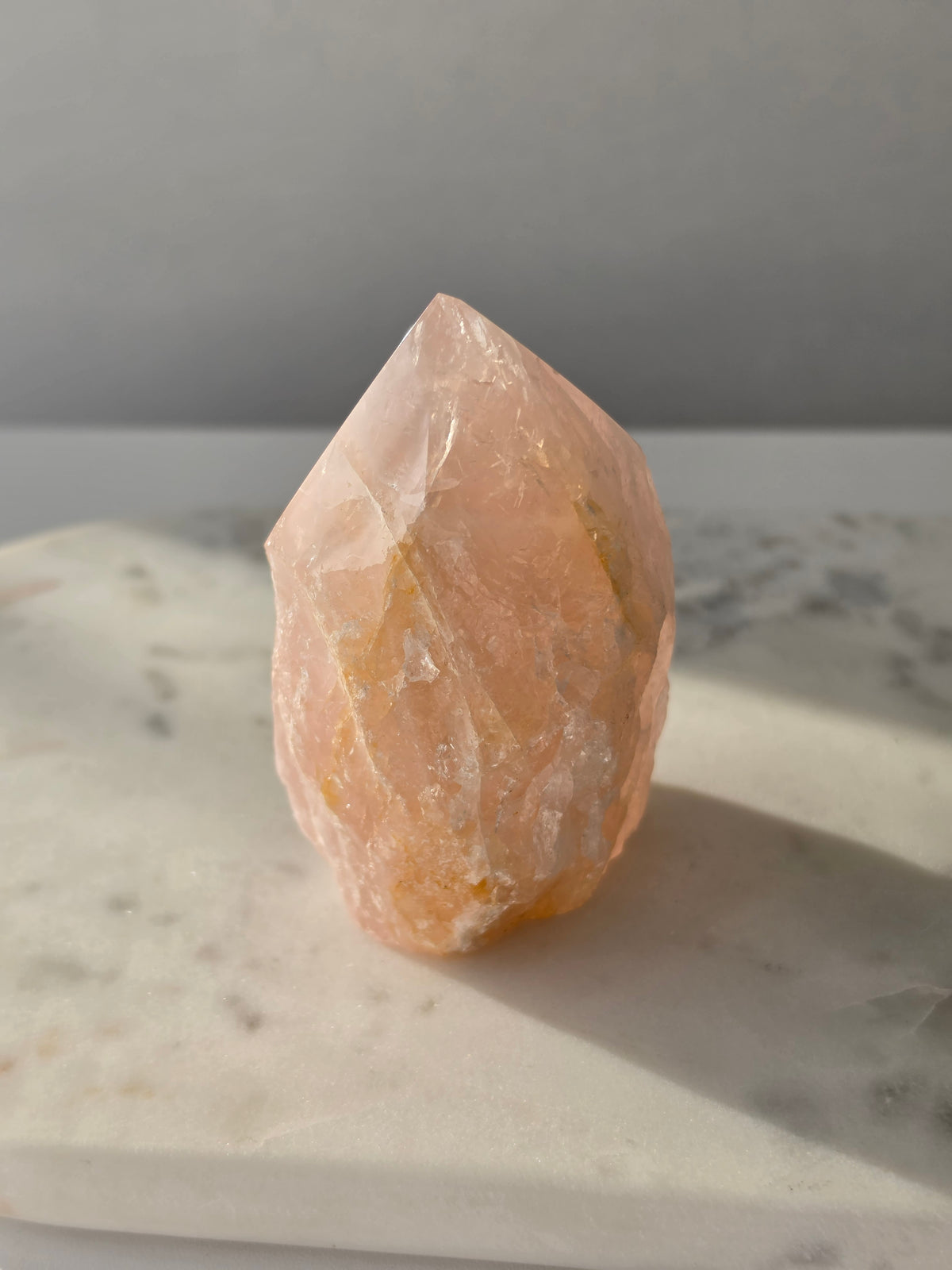 Chunky Rose Quartz and Golden Healer Quartz tower with soft blush pink colouring, warm golden inclusions and a combination of raw crystal texture and polished surfaces