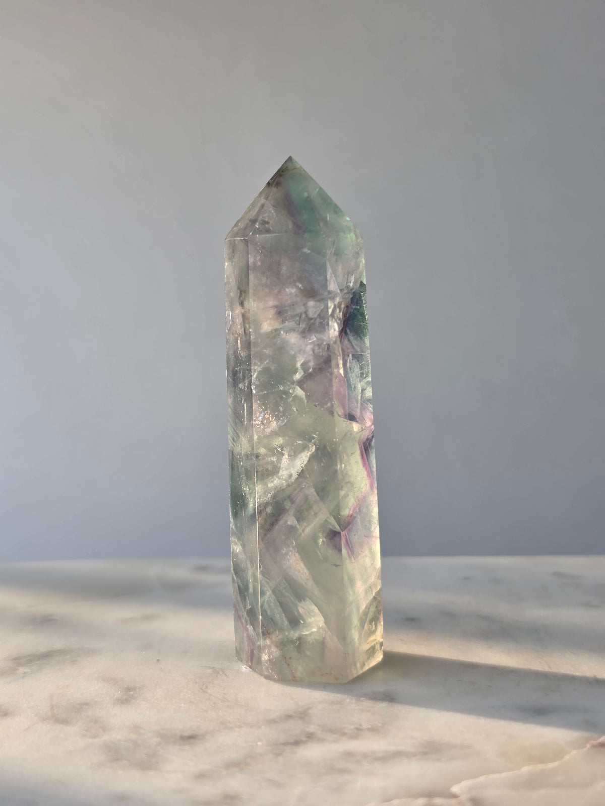 Natural Fluorite crystal point Translucent clarity with rainbow shine purple and light green colour zoning, transparent polished finish and unique internal formations