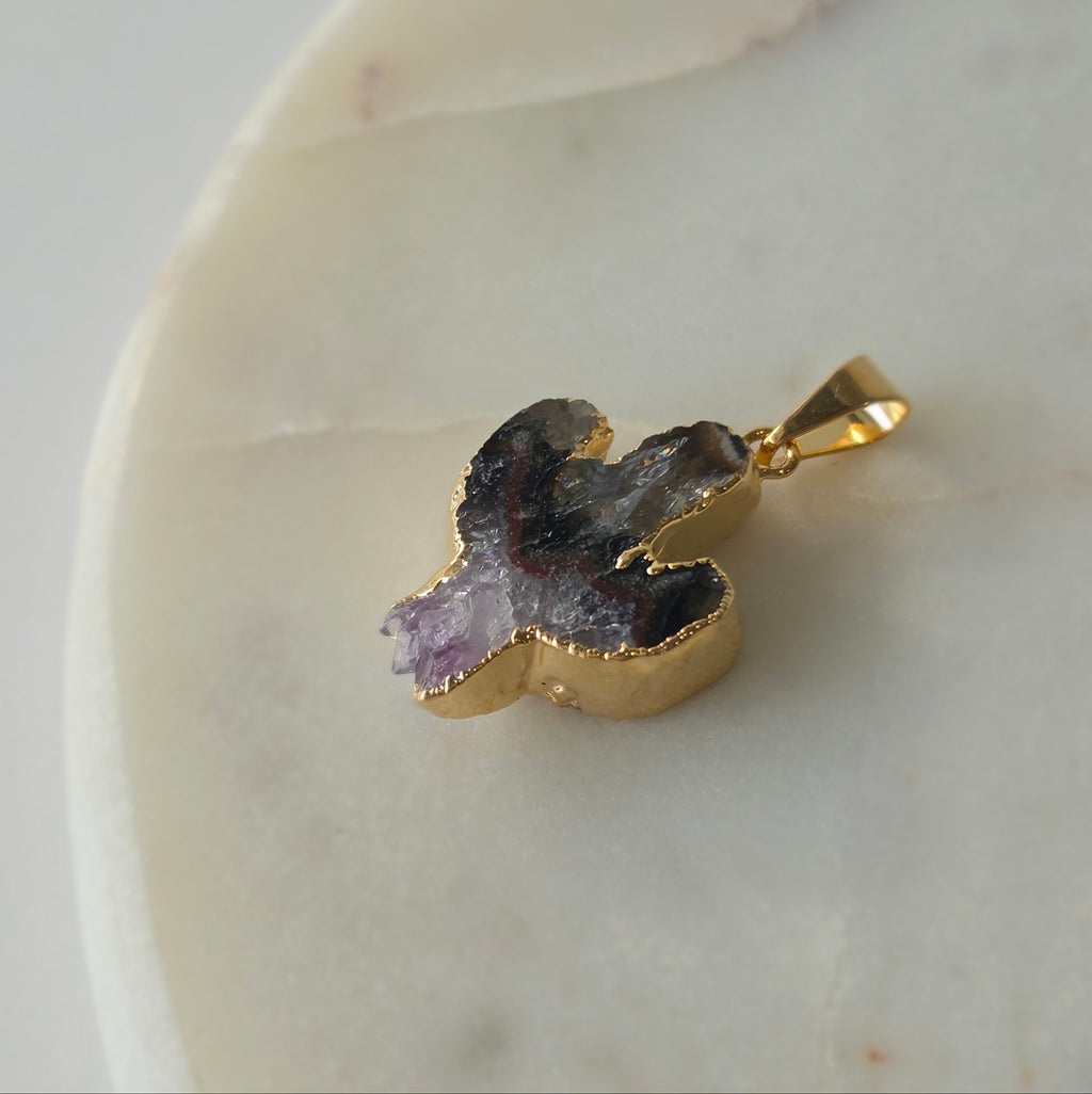 Amethyst and agate cactus slice pendant featuring deep translucent smoky-grey agate, red banding and purple crystal formations and a 24K gold-plated outline.