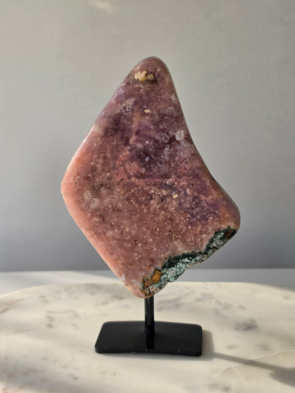 Brazilian Pink Amethyst slab on display stand with rich pink and purple colouring, sparkling purple and pink druzy and natural Jasper inclusions, 645g and 18.5cm