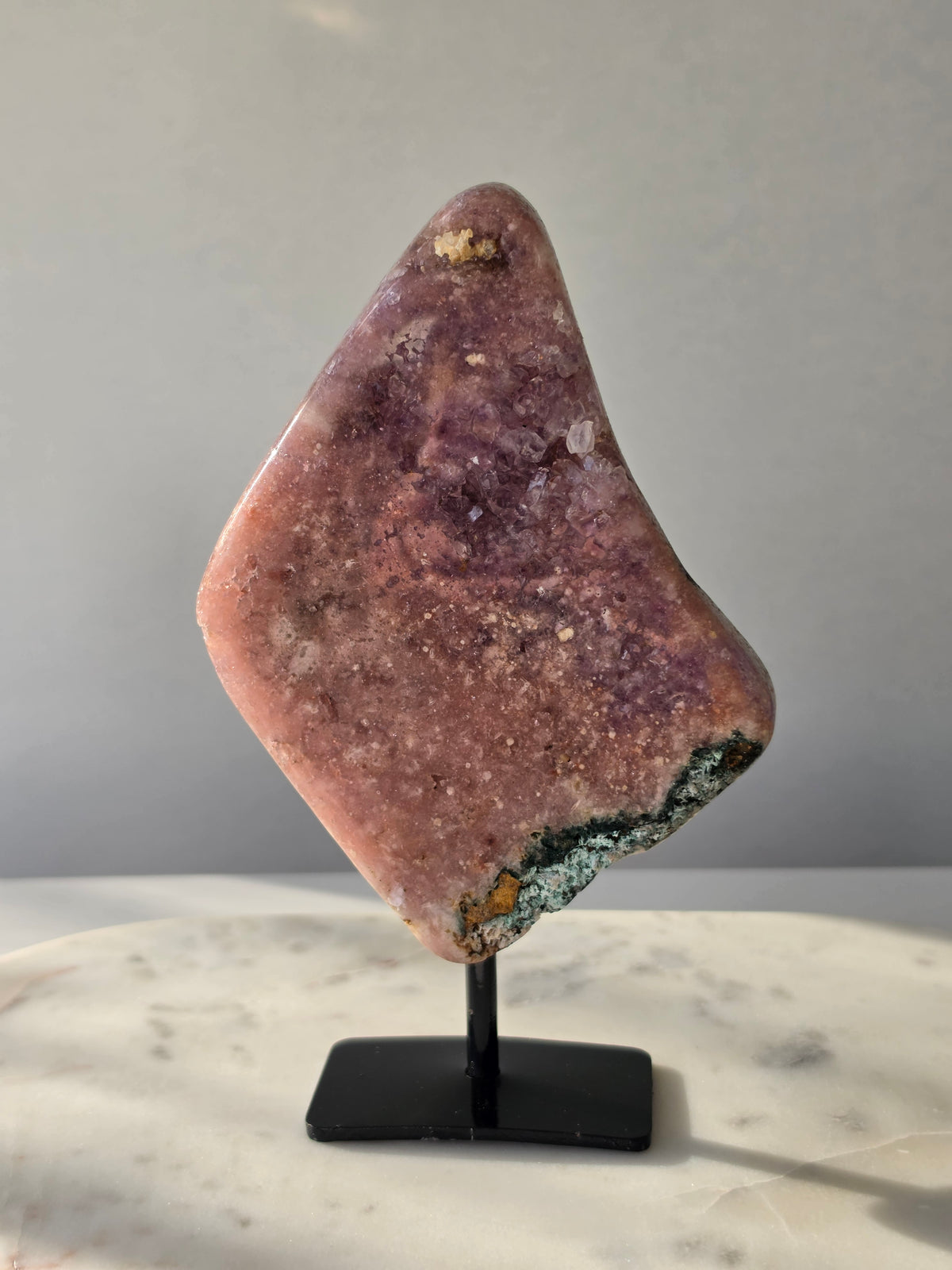 Brazilian Pink Amethyst slab on display stand with rich pink and purple colouring, sparkling purple and pink druzy and natural Jasper inclusions, 645g and 18.5cm
