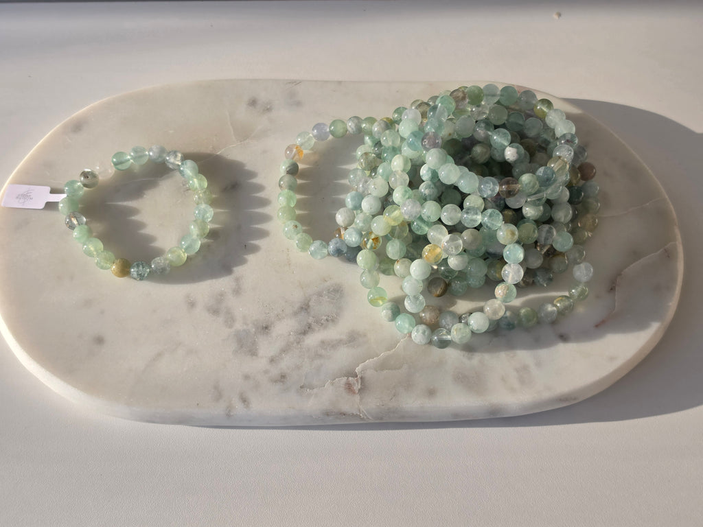 Natural Green Fluorite bracelet with polished translucent mint-green gemstone beads, luxury crystal jewellery by Stone & Bloom.