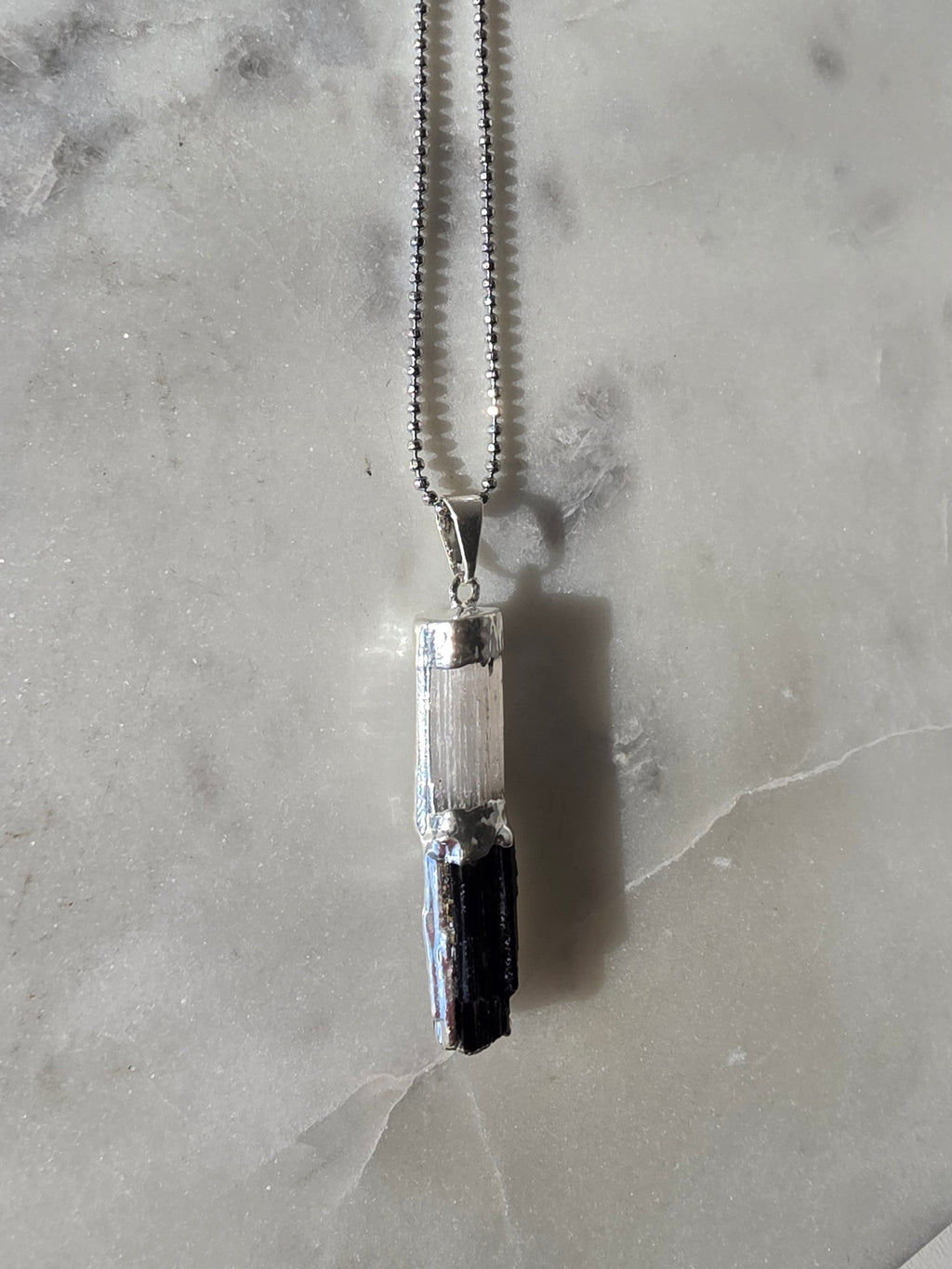 Natural Selenite and Black Tourmaline crystal pendant in a refined Premium Silver Plated setting, Stone & Bloom Raw Luxe Collection