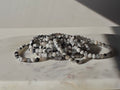 Natural Rainbow Moonstone bracelet featuring polished milky beads with soft translucent tones and luminous blue iridescent flashes