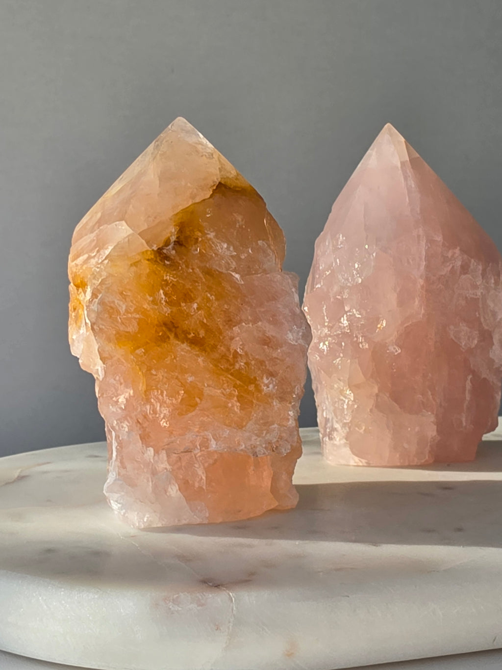 Chunky Rose Quartz and Golden Healer Quartz tower with soft blush pink colouring, warm golden inclusions and a combination of raw crystal texture and polished surfaces