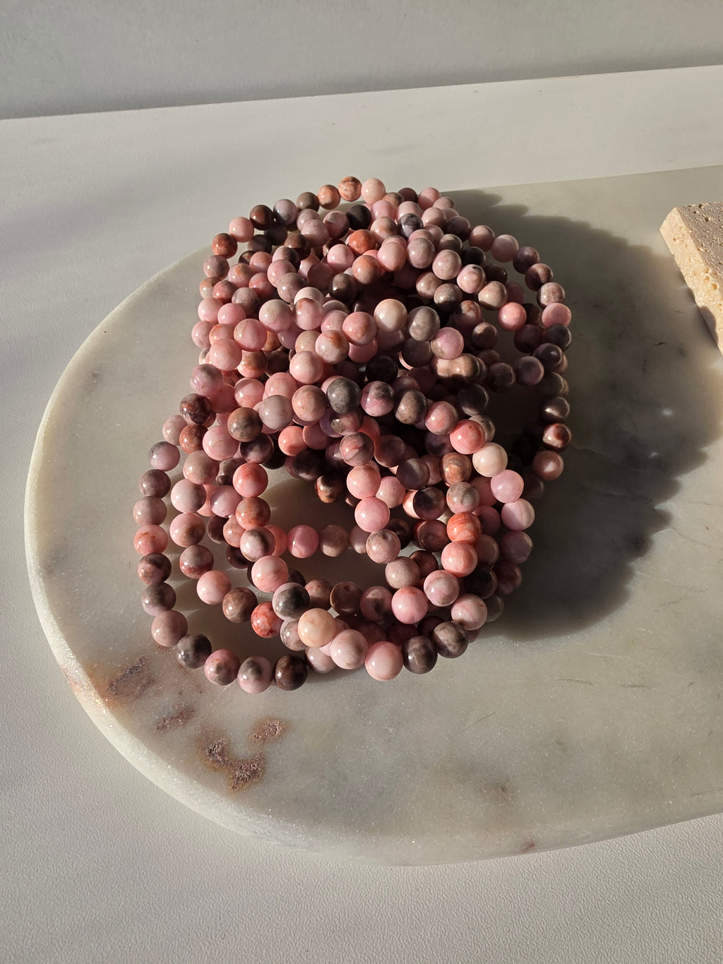 High-grade natural Pink Opal beaded bracelets featuring soft blush pink, dusty rose, mauve, and taupe gemstones with a smooth polished finish, handcrafted with premium quality stones and photographed in natural light.