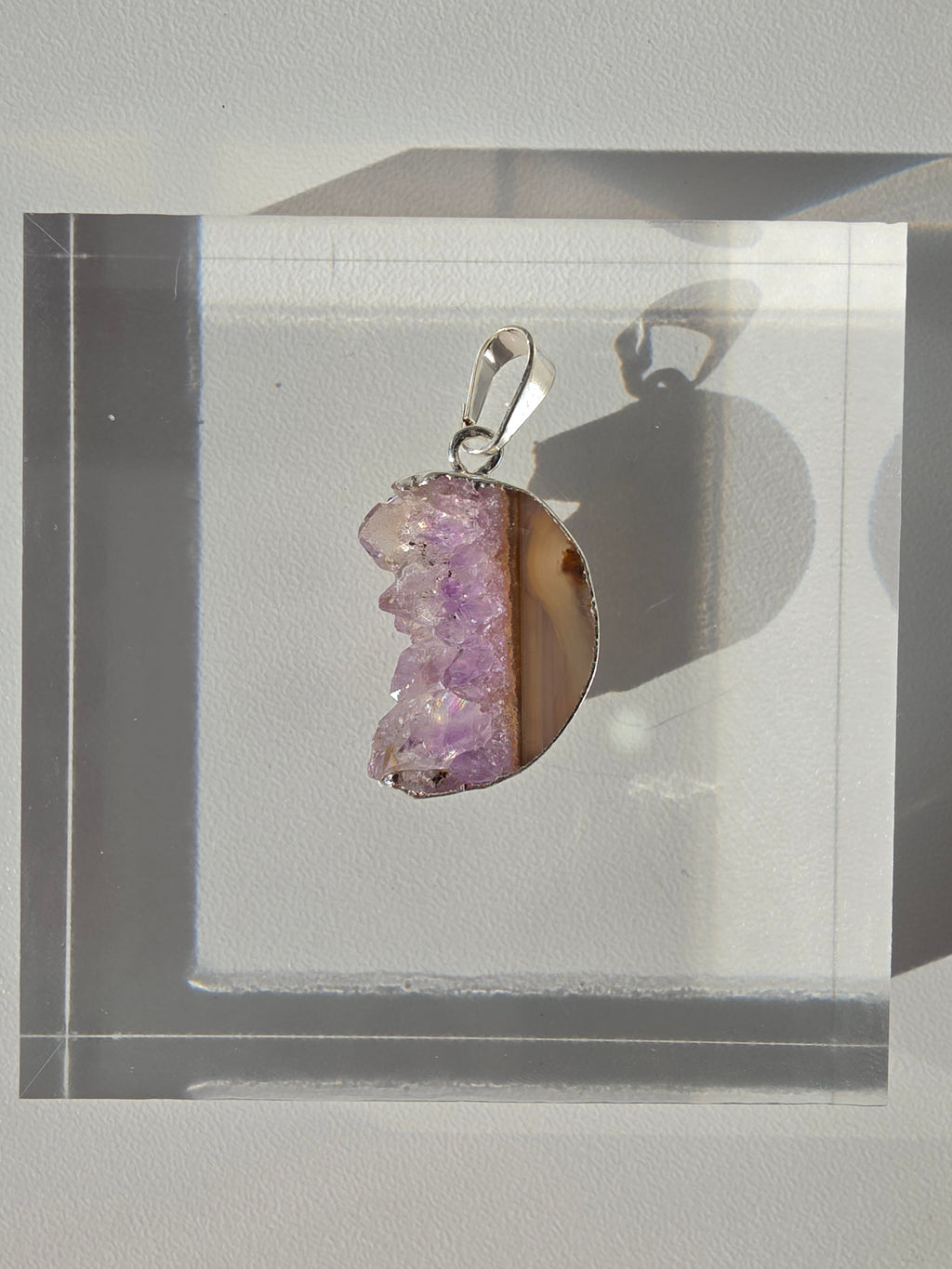 Natural Amethyst Slice Moon Pendant, raw crystal druzy pendant in a silver-plated setting from the Stone & Bloom Raw Luxe Collection.