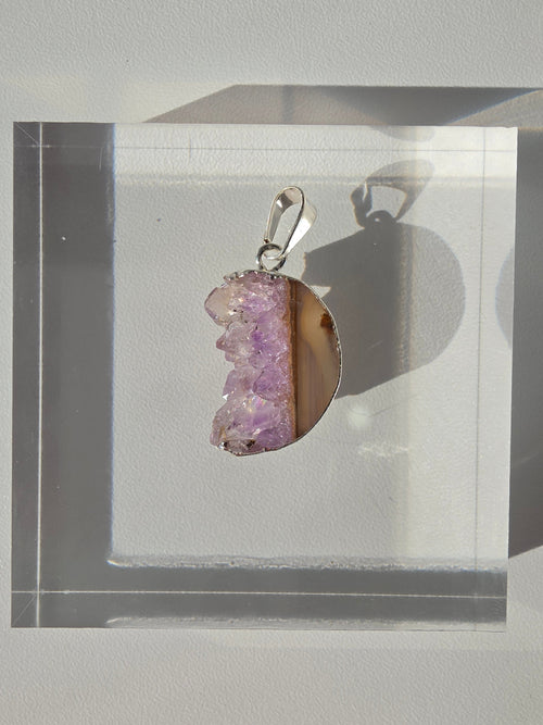 Natural Amethyst Slice Moon Pendant, raw crystal druzy pendant in a silver-plated setting from the Stone & Bloom Raw Luxe Collection.