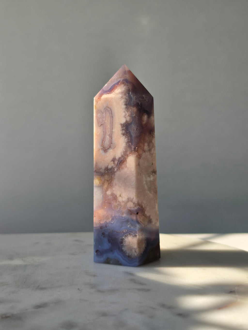 Blue Flower Agate crystal point with soft blue, lavender and cream tones and natural flower-like plume inclusions