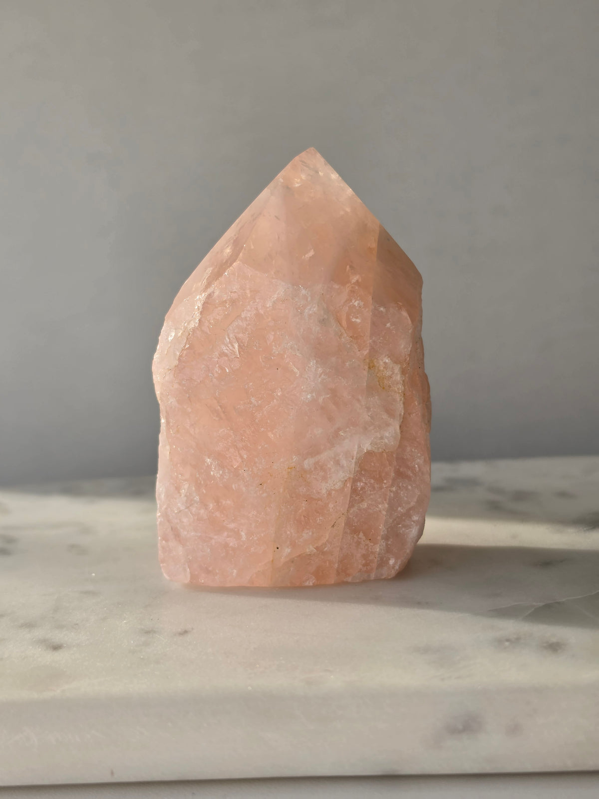 Chunky Rose Quartz and Golden Healer Quartz tower with soft blush pink colouring, warm golden inclusions and a combination of raw crystal texture and polished surfaces