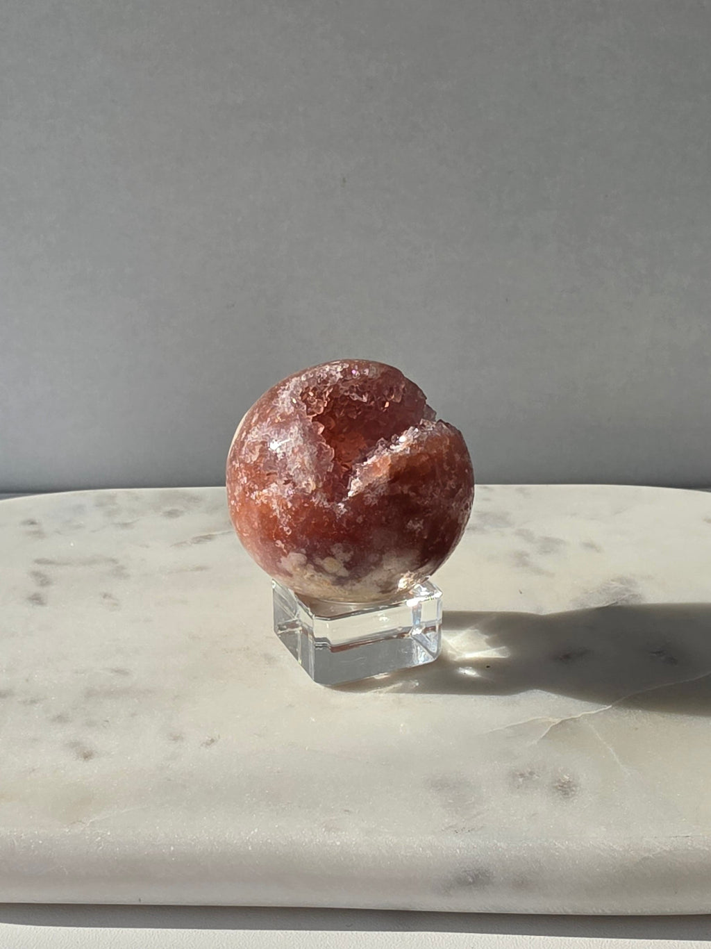 Brazilian Pink Amethyst sphere in rich blush and red-pink tones with sparkling druzy crystal formations and a natural crystalline centre, Stone & Bloom