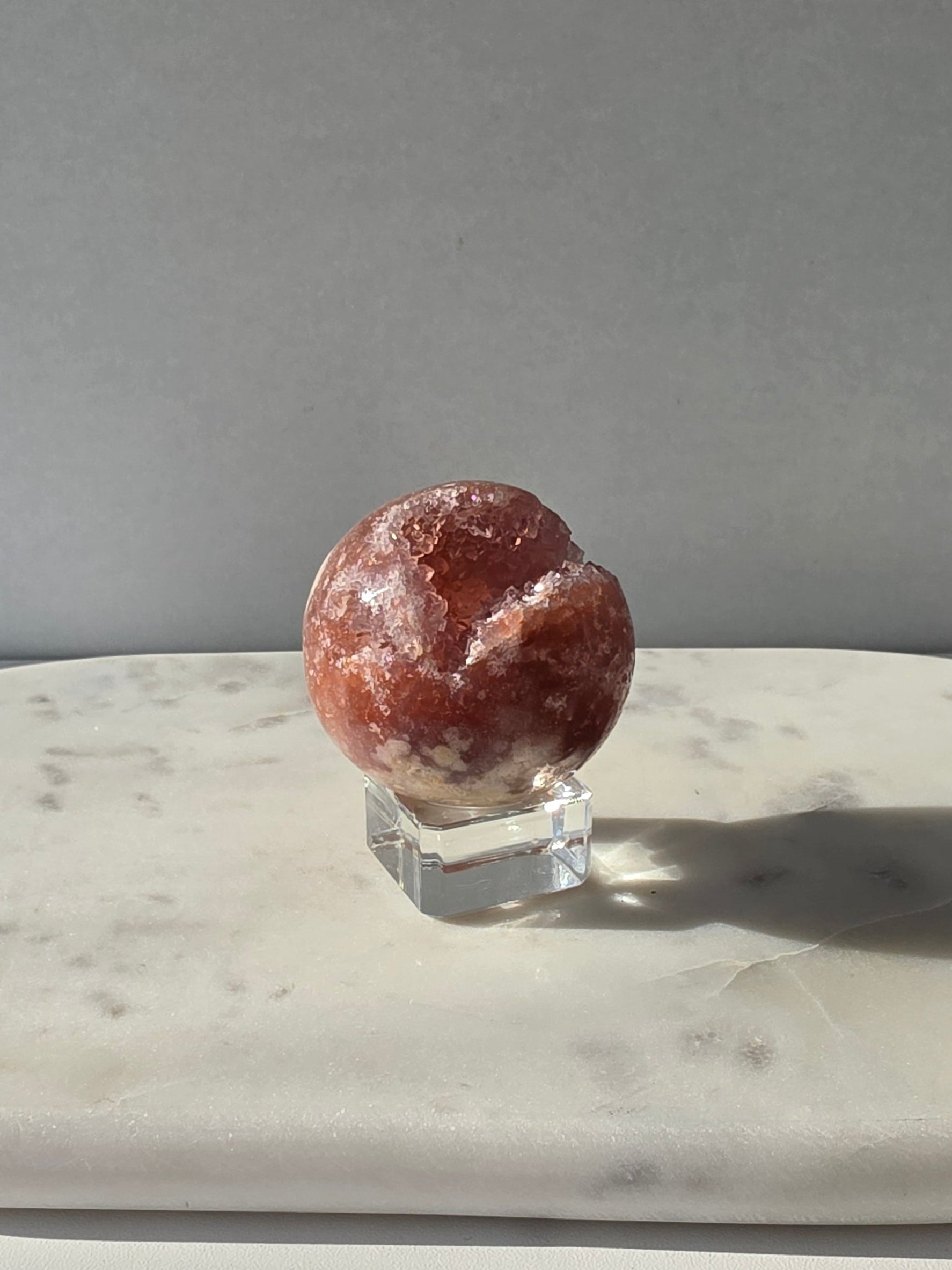 Brazilian Pink Amethyst sphere in rich blush and red-pink tones with sparkling druzy crystal formations and a natural crystalline centre, Stone & Bloom