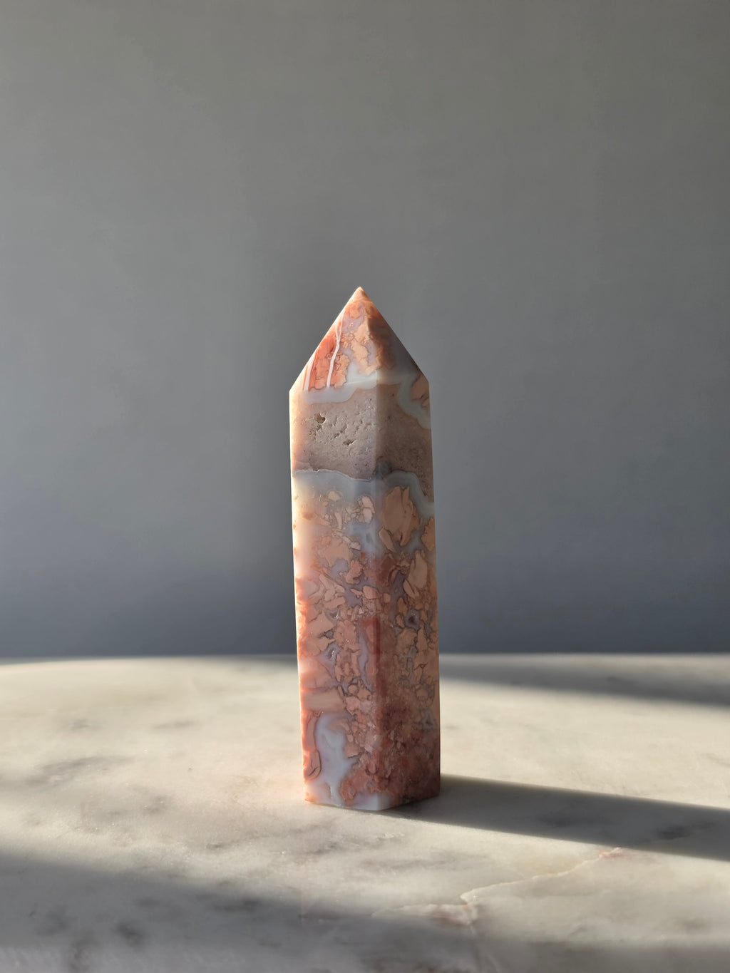Shop this exquisite Cotton Candy Agate Point, featuring delicate flower-like plume formations in dreamy blush pink, peach and blue-grey tones.
