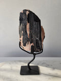 Black Tourmaline on Feldspar matrix from Brazil featuring naturally formed black crystals, contrasting pale matrix, black display stand, 910g, 19.5 × 6.5cm.