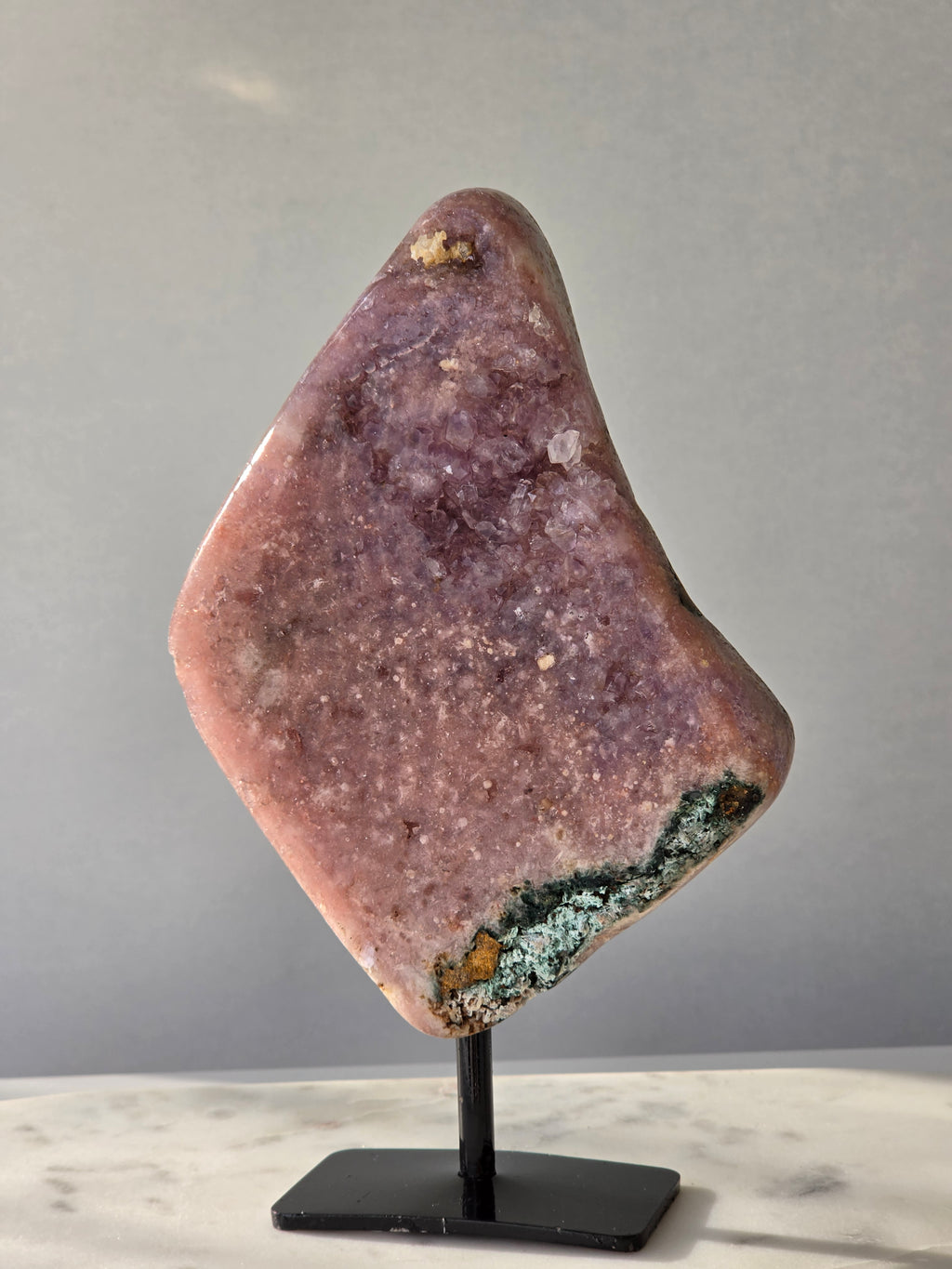 Brazilian Pink Amethyst slab on display stand with rich pink and purple colouring, sparkling purple and pink druzy and natural Jasper inclusions, 645g and 18.5cm