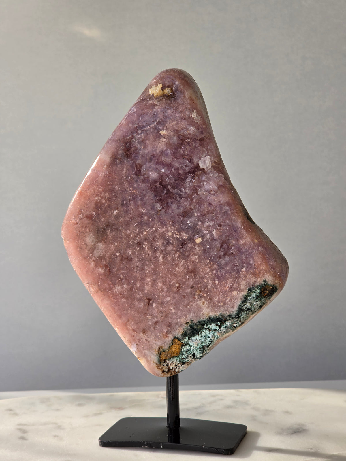 Brazilian Pink Amethyst slab on display stand with rich pink and purple colouring, sparkling purple and pink druzy and natural Jasper inclusions, 645g and 18.5cm