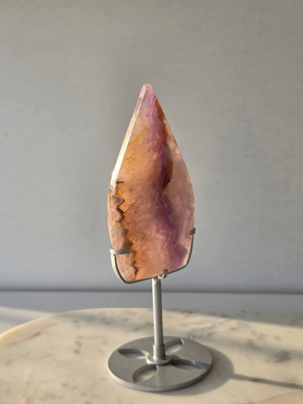 Amethyst Lace Agate flame on a silver stand featuring soft lavender, lilac and creamy white natural banding and intricate lace-like patterns, luxury crystal décor.