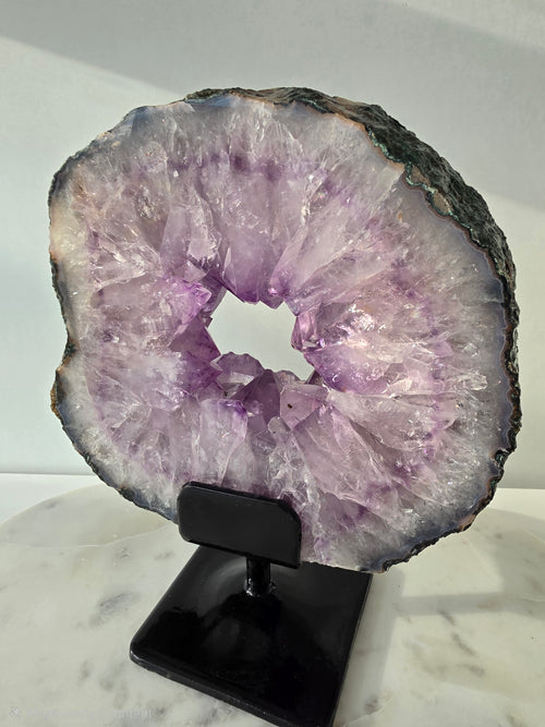 Brazilian Amethyst Portal on stand featuring natural purple quartz crystal druzy, luxury crystal décor, healing crystal display by Stone & Bloom
