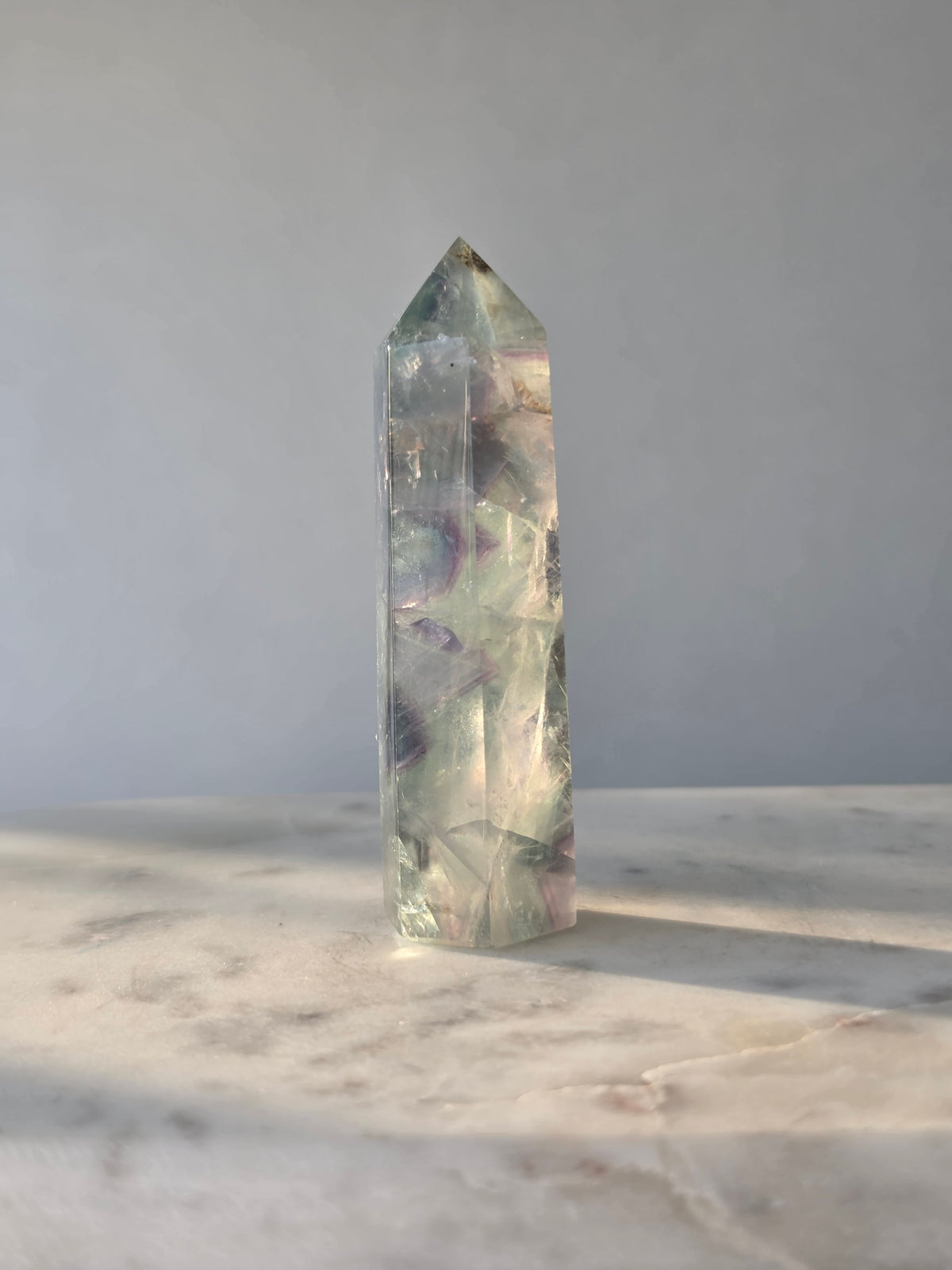 Natural Fluorite crystal point Translucent clarity with rainbow shine purple and light green colour zoning, transparent polished finish and unique internal formations