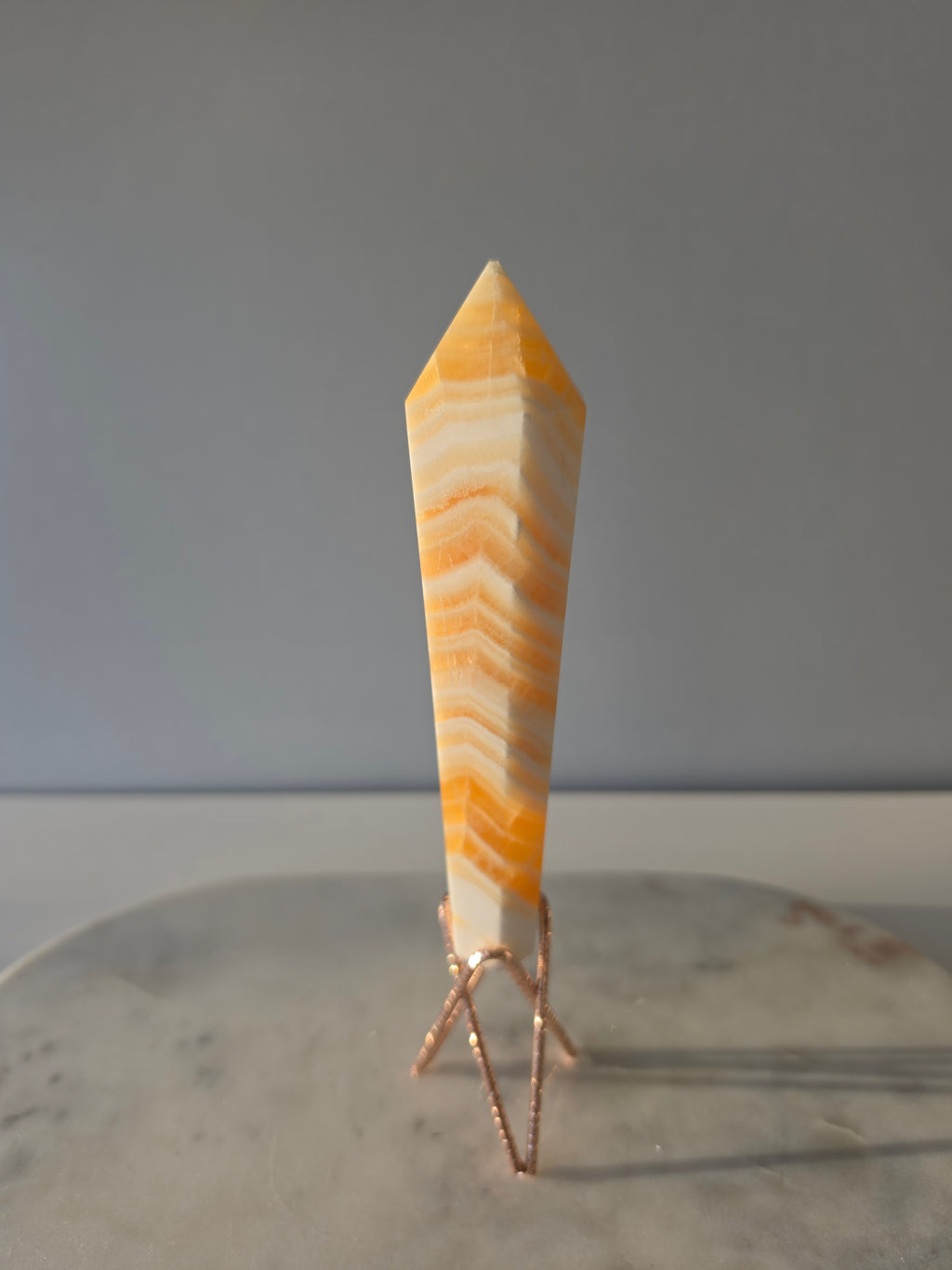 Luxury Yellow Banded Calcite Wand by Stone and Bloom featuring warm golden and cream natural banding, on trend, Crystals, Calcite, Wand
