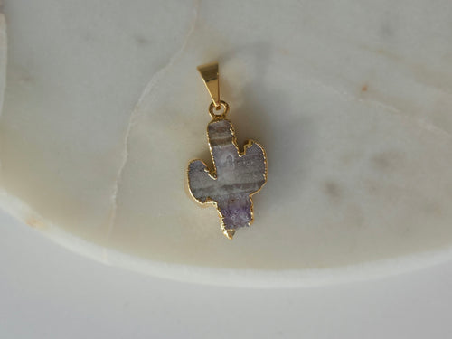 Amethyst and agate cactus slice pendant featuring agate banding, purple crystal formations and a 24K gold-plated outline.