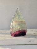 Shop Candy Fluorite Flames featuring dreamy pastel purple, blue and green tones, beautiful natural colour zoning and a polished sculptural finish.