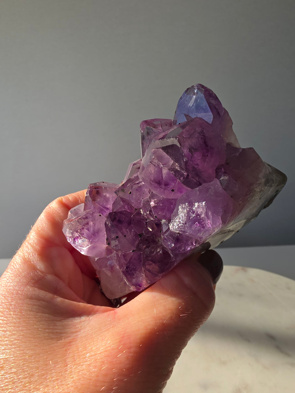 Intense purple Amethyst polished freeform with raw chunky crystal formations and natural Goethite and Hematite inclusions