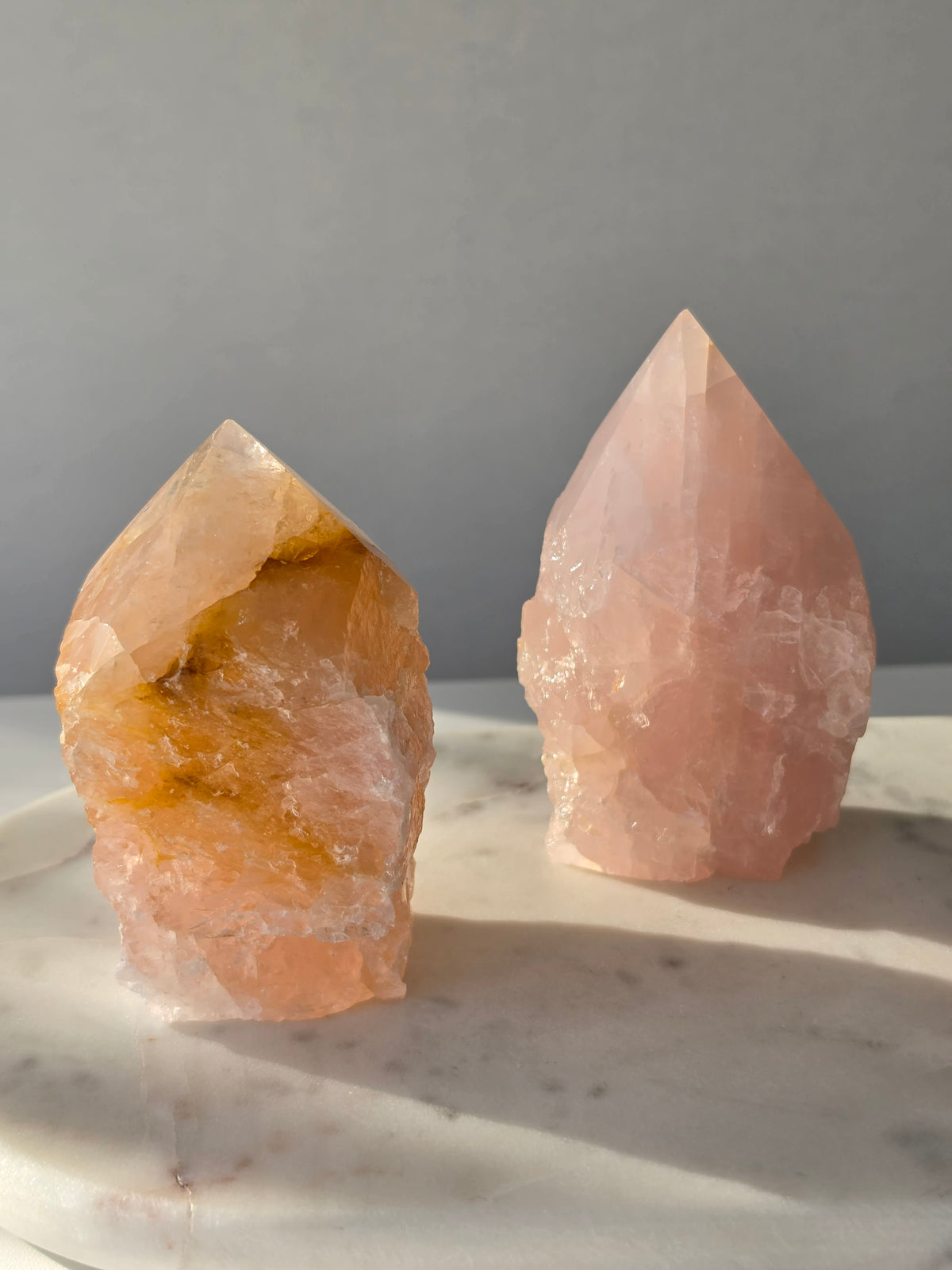 Natural Rose Quartz tower with soft blush-pink colouring and subtle warm golden inclusions, weighing 466g and measuring 10cm
