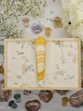 Luxury Yellow Banded Calcite Wand by Stone and Bloom featuring warm golden and cream natural banding, on trend